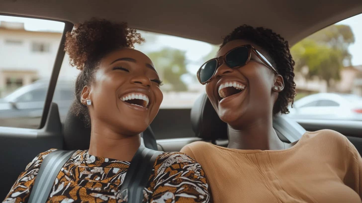 Friends enjoying a chauffeured ride in Lagos with Muvment by Autogirl